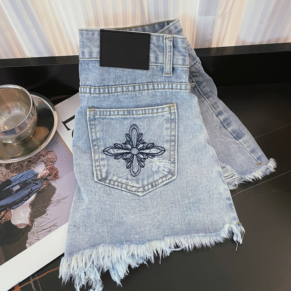 實拍設計感釘扣口袋刺繡毛邊淺色牛仔短褲女高腰a字顯瘦辣妹熱褲
