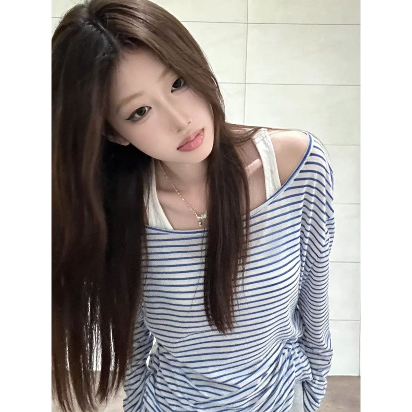 韓系純欲風斜肩條紋寬松防曬罩衫女薄款微透長袖t恤上衣