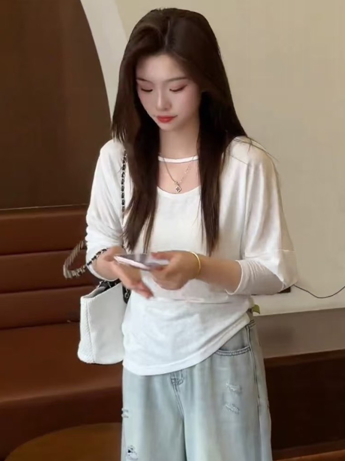 부드러운 바람 양성 및 음성 양면 착용 긴팔 티셔츠 여성 2026 여름 새로운 디자인 센스 패션 고유 한 Chic 맨위