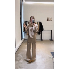 批发秋冬新款气质时尚不规则套头针织衫+镂空屁帘假两件针织裤套装