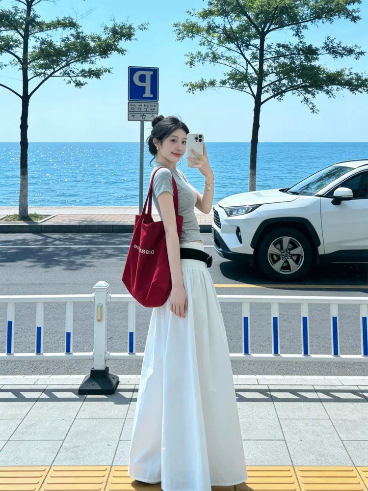 한 부서 고급 센스 화이트 반신 스커트 여성 봄 여름 새로운 2026 루즈핏 슬림해 보이는 도루 센스 한 마디 하얀 달빛 롱 스커트