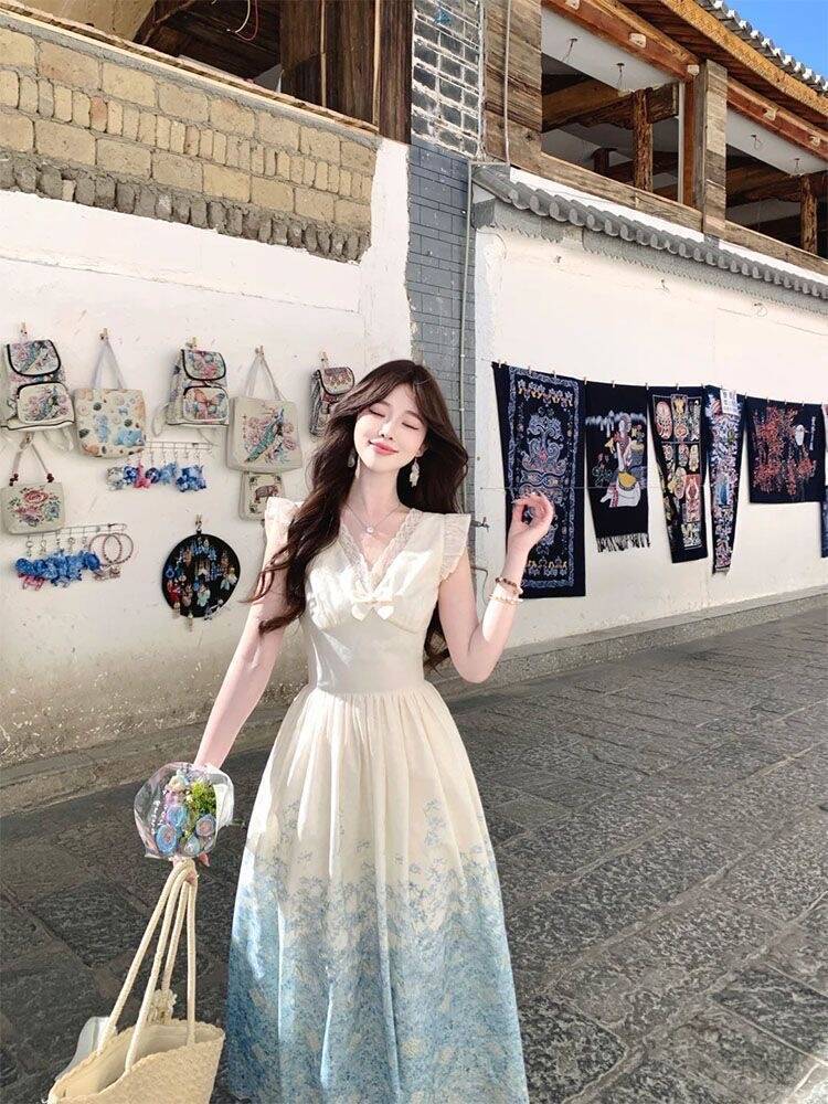 새로운 디자인 센스 허리 수축 프랑스식 절묘한 V넥 나비 매듭 민소매 여성 드레스 품격 프린트 슬림해 보이는 롱 스커트