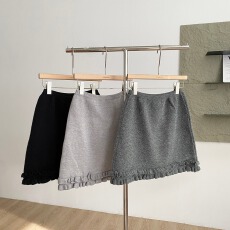 批发2025秋季新款纯色高腰显瘦重工木耳边百搭A字针织包臀短裙半身裙