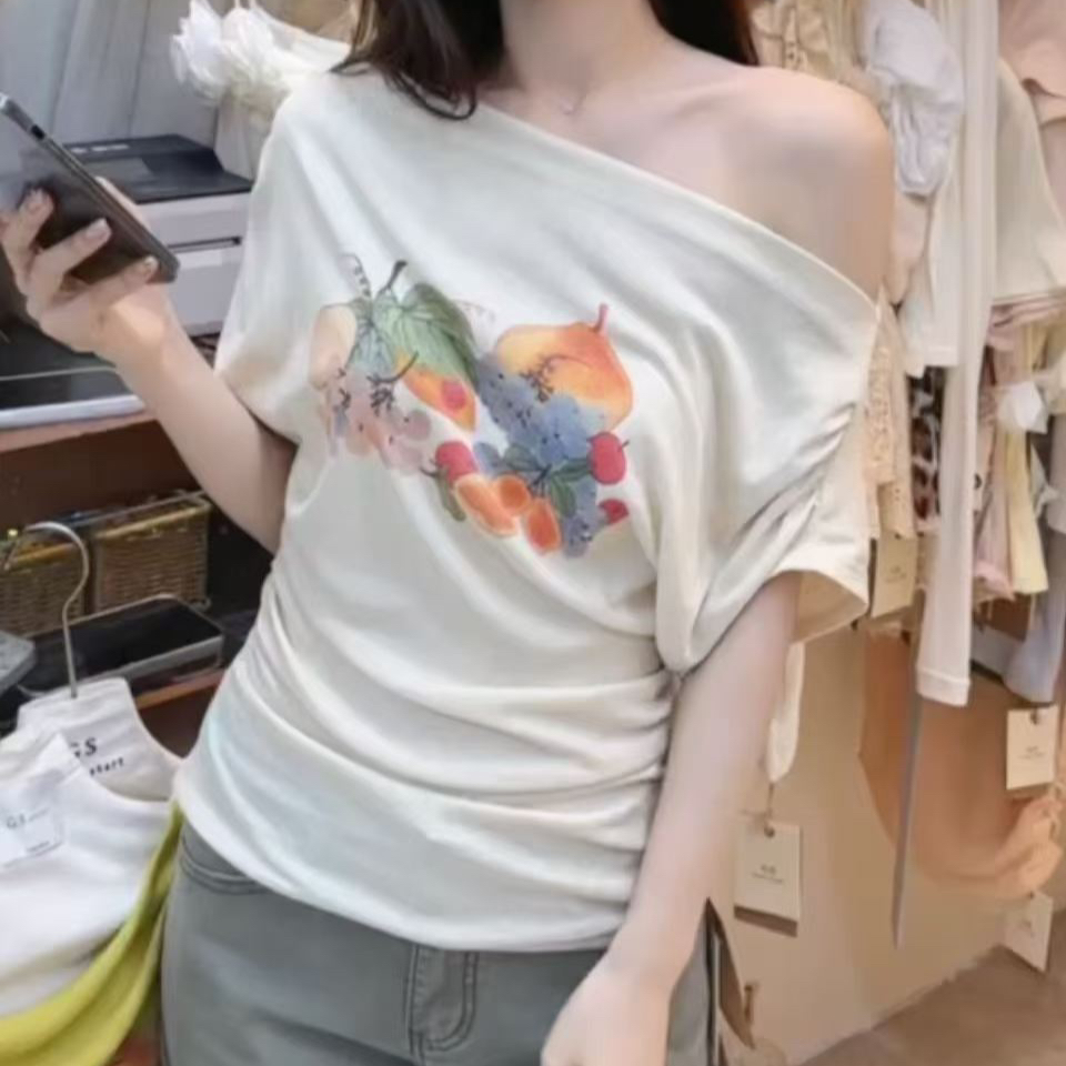 재고 있음 빅 사이즈 지방 mm 한 부서 느긋한 바람 화이트 비스듬한 어깨 반팔 티셔츠 여성 여름 과일 인쇄 꽃 슬림해 보이는 맨위