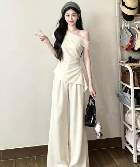 캐주얼 스포츠 슈트 여성 여름 새로운 비스듬한 어깨 펌프 Pleat 리본 몸매 가꾸기 맨위 와이드 레그 팬츠 투피스 세트 한국 대외 무역
