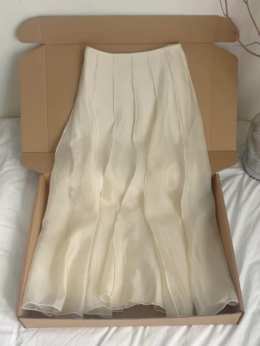 살구 색상 반신 스커트 봄 여름 2026 년 새로운 하이웨이스트 슬림해 보이는 한 마디 플리츠 프릴 중간 길이 스커트