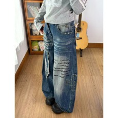 批发高街字母印花铆钉贴布弯刀牛仔裤女2026<b class='q'>秋</b>季新款设计感水洗阔腿裤
