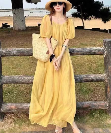 황색 백리스 여성 드레스 여름 섬 바람 도파민 롱 스커트 해변가 휴가 바람 슈퍼 요정 해변 치마