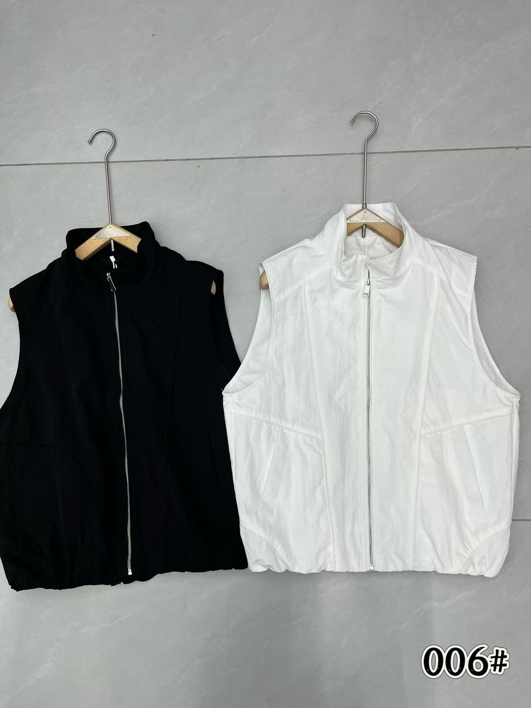 봄 여름 새로운 지퍼 스탠드 칼라 쇼트 스타일 워크웨어 베스트 남자 여자 스택 착용 민소매 어깨 조끼 조수 브랜드 재킷