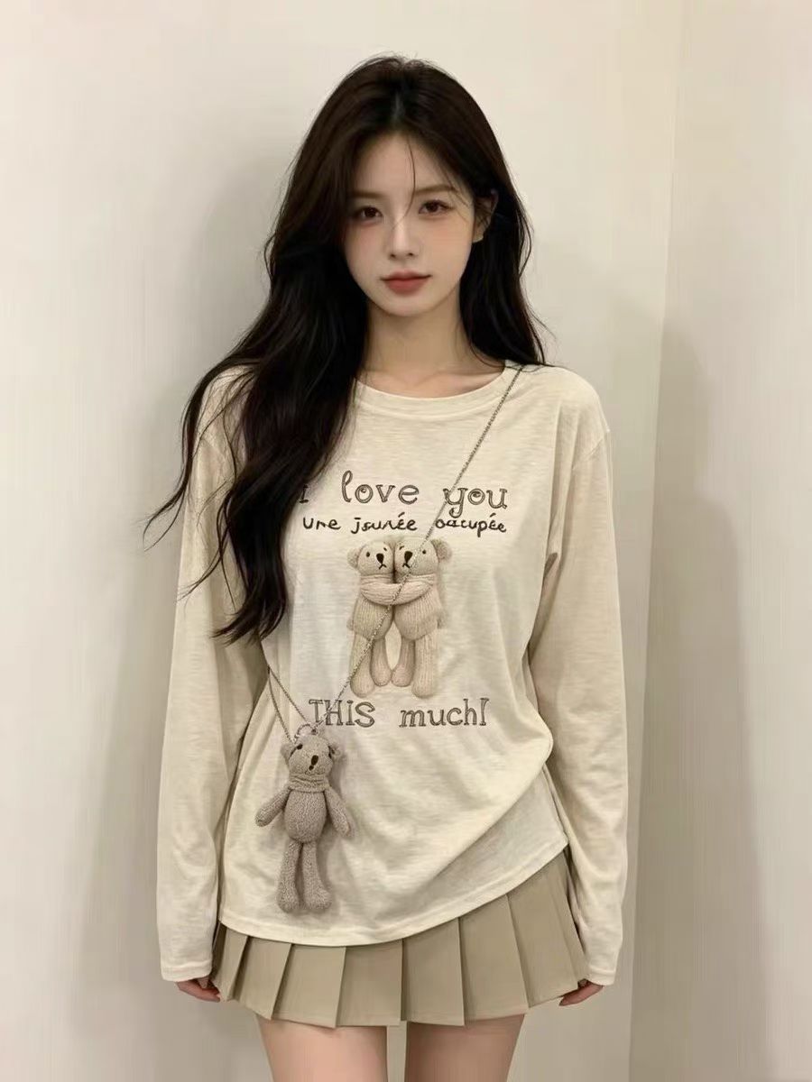 26 여름 새로운 루즈핏 캐주얼 만화 작은 곰 프린트 비스듬한 어깨 긴팔 티셔츠 자외선 차단 블라우스 여성 경기 펜던트
