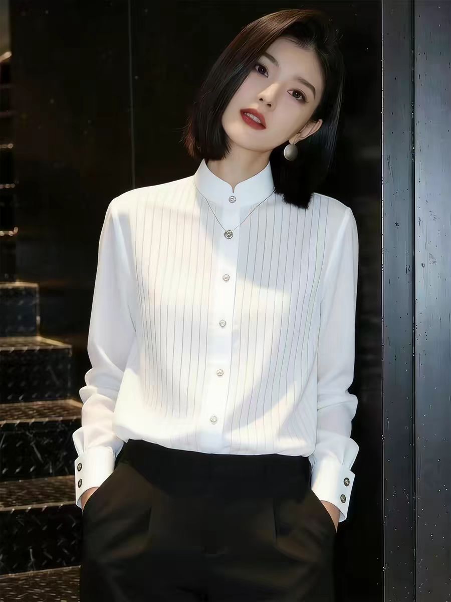 프랑스식 출퇴근 바람 화이트 스탠드 칼라 긴팔 여성 셔츠 2026 년 봄 새로운 디자인 센스 슬림해 보이는 다용도 맨위