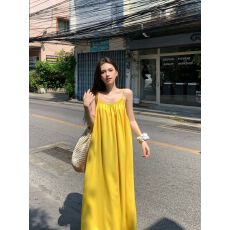 批发海边度假性感露背<b class='q'>吊带</b>连衣裙女夏季新款宽松a字裙温柔黄色<b class='q'>长裙</b>子