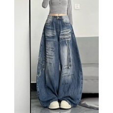 批发美式复古铆钉弯刀牛仔裤女2025秋冬季新款设计感宽松显瘦阔腿裤子