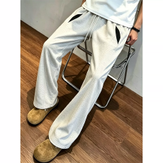 批发撞色008拼接斜切卫裤男春秋季潮牌高级感<b class='q'>显瘦</b>弯刀裤子直筒微喇裤
