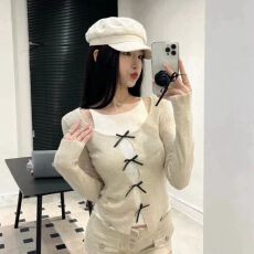 批发辣妹风杏色圆领长袖修身蝴蝶结镂空假两件毛针织衫 显瘦气质